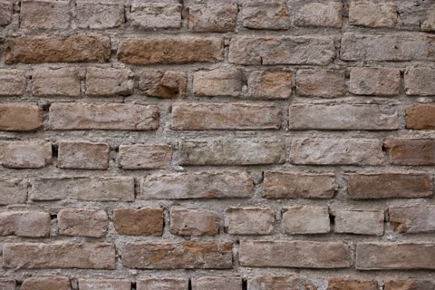 Aged mixed brick wall